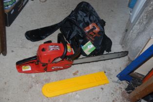 A Chainsaw with brake, blade cover and bag.
