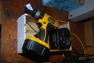 A Dewalt cordless with spare battery and charger.