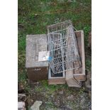 A Military Ammo-box, three small Chicken Feeders and a Rat Cage/Catcher.