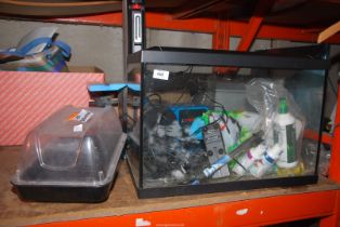 A fish tank with accessories, plus a small seed Germinator.