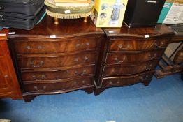 A pair of Mahogany crossbanded serpentine fronted chests of four drawers.
