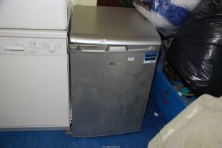 A 'Beko' three drawer under-counter silver freezer.