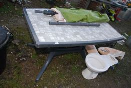 Plastic table with windup Parasol.