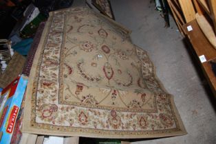 A beige 'Legacy' design rug - 120 x 170cm.