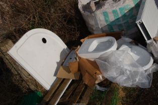 A shower base, toilet system and two hand basins.