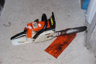 A 'Stihl' 024 Chainsaw with chain brake - (working at time of lotting).