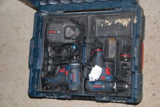 Two 'Bosch' cased electric drills with charger.