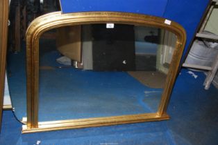 A gilt frame oval topped mirror - 39" wide x 29" high.