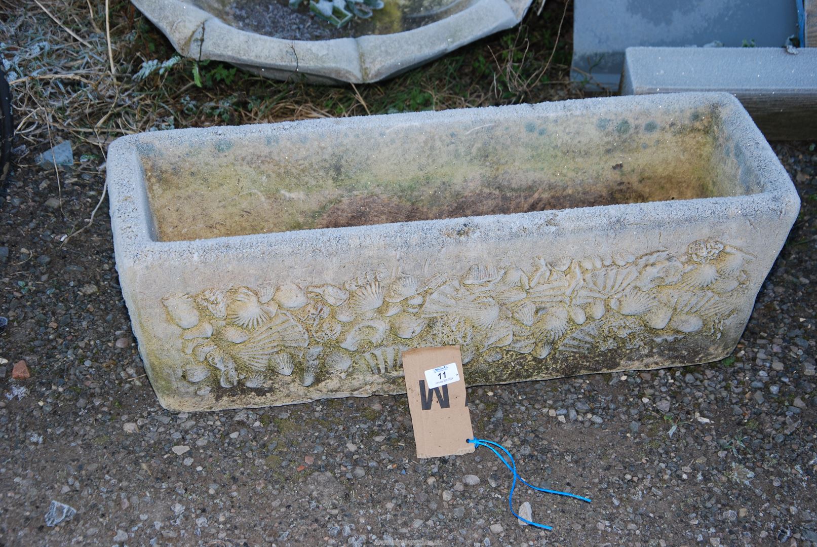 A concrete Planter - 30" wide x 10" depth x 10" high.