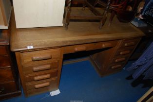 A military style light oak desk - 5' x 34" x 30" high.