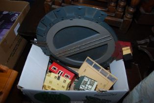 A quantity of model railway components including train turntable and railway furniture.
