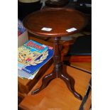 A small circular wine table.