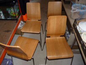 Four plywood chairs.
