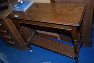 A small oak hall table,( lower shelf loose, a/f) - 3' x 14½" x 30" high.