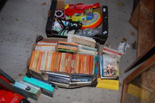 Various Children's games including a skipping rope, puzzles, and penguin books.