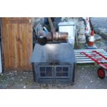 A large Woodburner with back boiler and pipe work - 32" wide x 18" depth x 33" high.