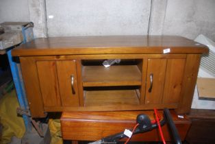 A Television stand with two cupboards - 47½" wide x 17½" depth x 20" high.