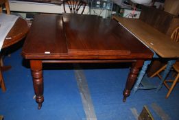 A probably Edwardian Mahogany extending Dining table standing on turned and reeded legs 47 1/2" x