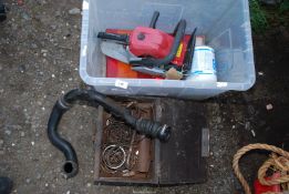 A box of Piston rings, a tub of Commercial rear-tail lamps, Chainsaw engine (no cutter bar),