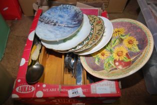 A box of china and cutlery.