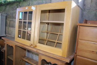 A wall cupboard with glass doors (1 x A/F) - 39½" wide x 12" depth x 23½" high.