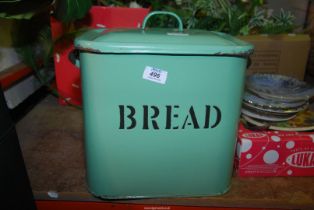 A green enamel bread bin.