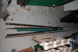 A quantity of fishing rods, including a Farlows strand of London fishing rod.