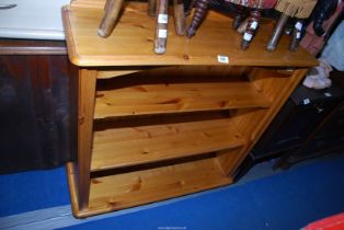 A pine bookcase - 38" wide x 12½'' depth x 38" high.