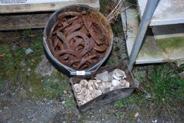 A bucket of Horseshoes and a tub of Bakelite Door-knobs.