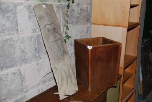 A wooden planter and wood carving.
