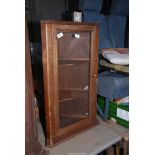 A wooden corner Cupboard with two shelves - 31½" high x 18½" wide.