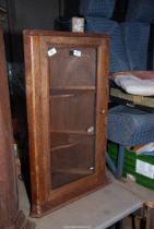 A wooden corner Cupboard with two shelves - 31½" high x 18½" wide.