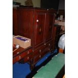 A Mahogany inlaid, cross-banded Linen Press with inlaid urn decoration to upper doors,