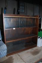 A wooden shelving unit with sliding top doors - 3' wide x 8½" depth x 3' High.