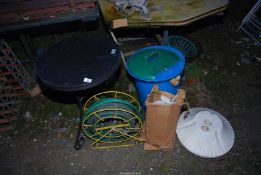 Circular metal Table, Hose-on-reel, Small Juicer press, and Plastic bin, etc.