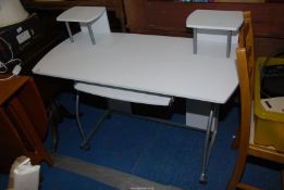 A metal legged computer table - 43" wide x 20" deep x 29" high.