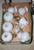 A quantity of wall lights and shades.