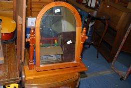 A pine table-top swing mirror.