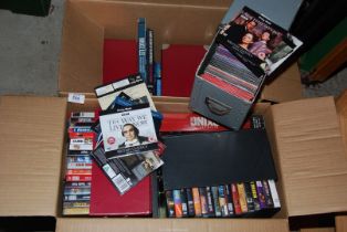 Two boxes of DVD's , etc.