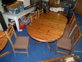 A pine extending kitchen table and 6 chairs.