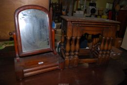 A nest of three oak tables, and a mahogany swing mirror with trinket drawer to the base.