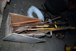 A wooden box of Gardening tools, including Spade and Rake, etc.