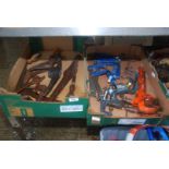 A box of brass hooks, pick axe, vice and clamp etc.