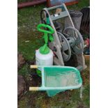 A wind-up Hose reel, Sprayer and Child's Wheelbarrow.