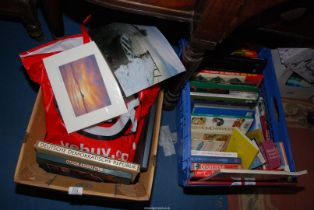 A quantity of picture frames and books in two boxes.