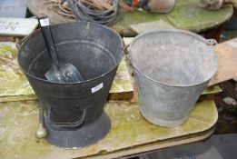 Two coal buckets and shovels.