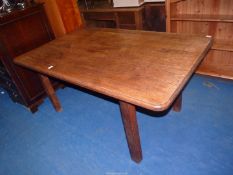 An Oak dining table with rounded corners and standing on square legs - 37" x 60" 29" high.