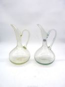 Two bubble glass ewer jugs.