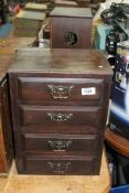 A compact table top flight of four short Drawers, 11 3/16'' x 9'' deep x 15 3/8'' high approx.