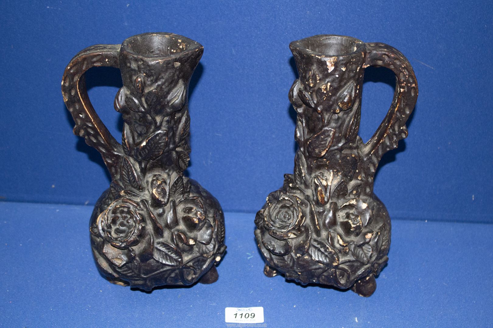 A pair of chalk ewer/Vases in black with applied flower and foliage decoration, 10 1/2" tall,